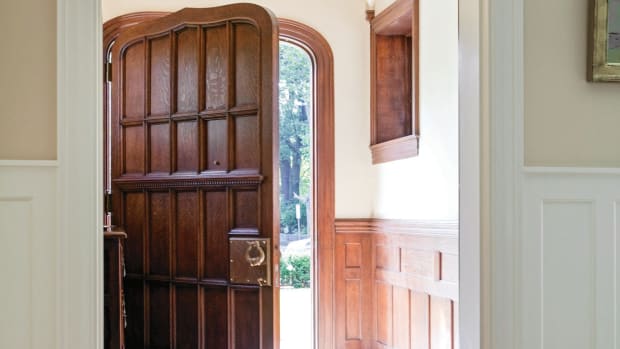 The Tudor-style door echoes the trim on the entryway.