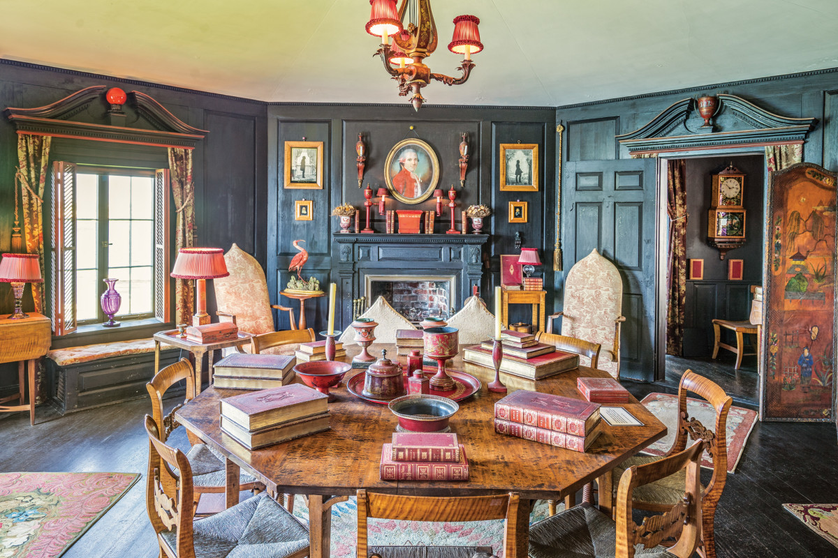 Colonial American, French, English and Asian decorative objects all make their home in Beauport’s interiors, creating an atmosphere based on both history and fantasy. Henry David Sleeper’s talent for combining color is evident in the eggplant colored woodwork, red platters, candlesticks and assorted containers and the light maple chairs.