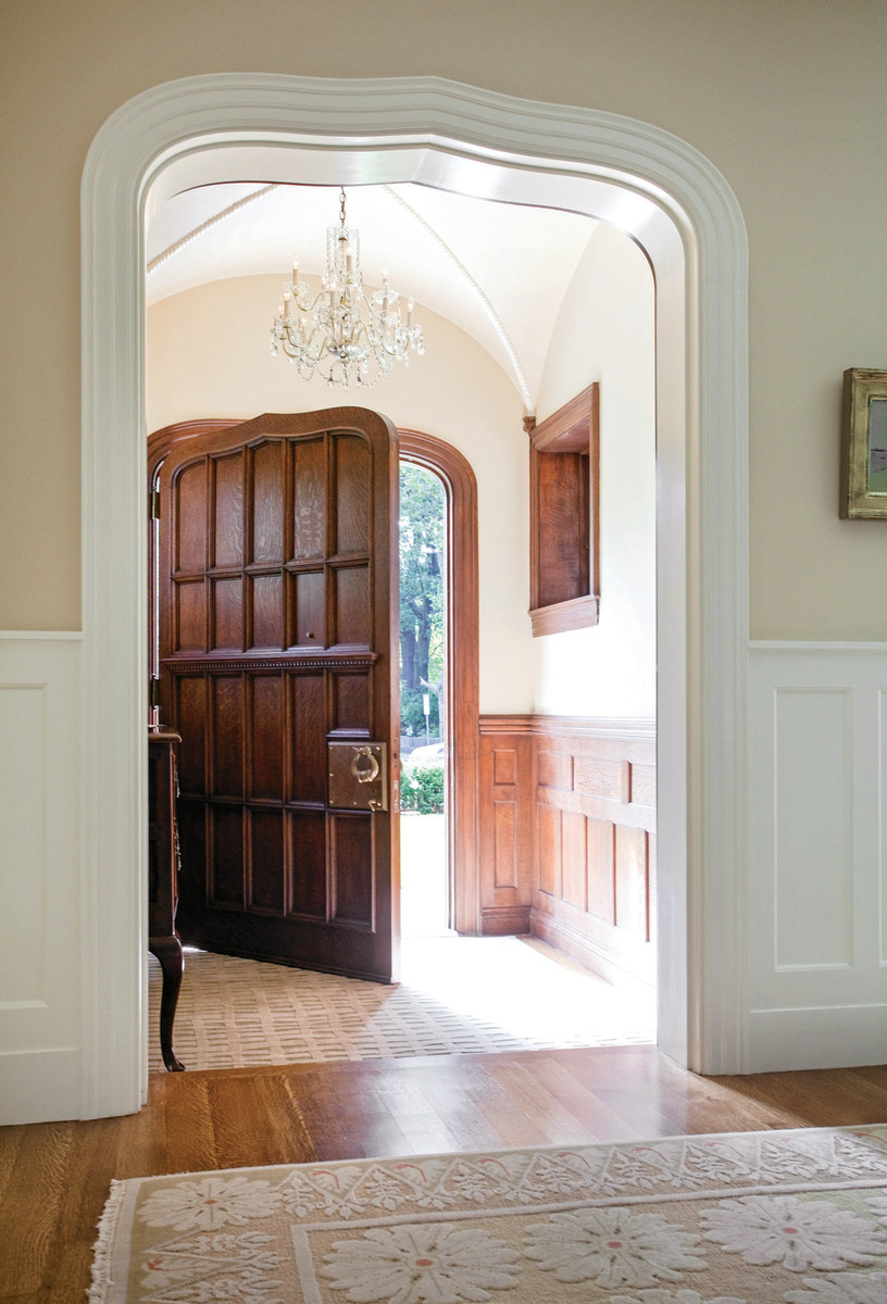 The Tudor-style door echoes the trim on the entryway.