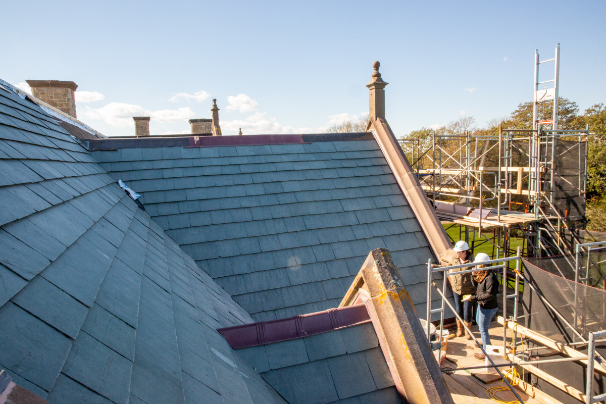 Repairs being made to the brownstone trim on the gables of Rough Point.